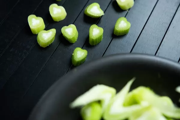 Flatlay of chopped fennel on a black surface (Flip 2019)