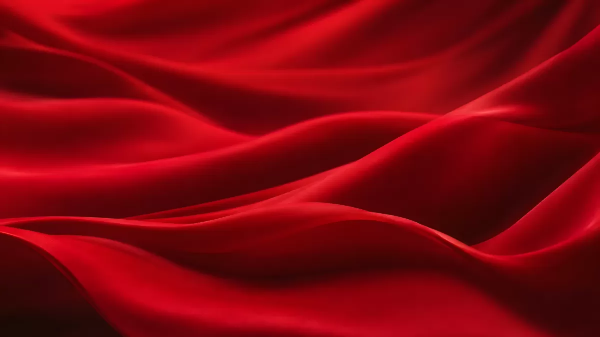 Fließender roter Seidenstoff in eleganten Wellen