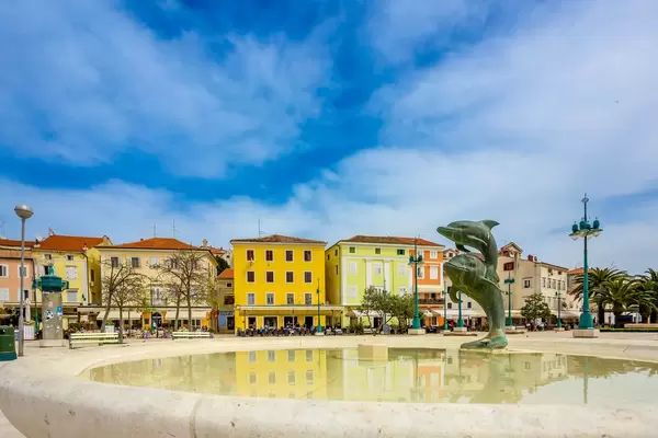 Fontain with statue of dolphins in town Mali Losinj, Croatia
