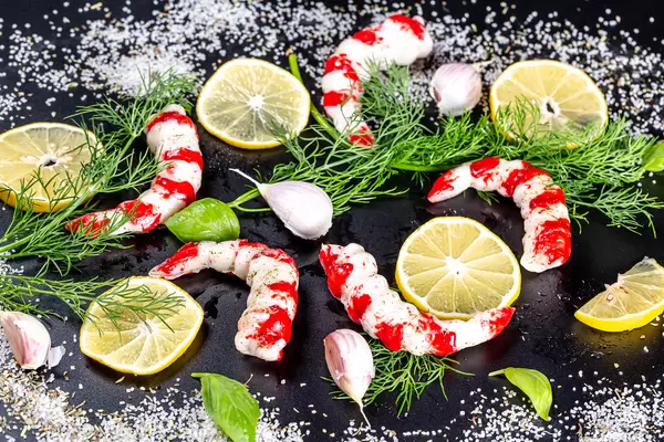 Food background delicious shrimp with spices on black