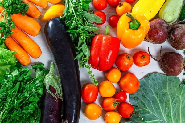 Food background with fresh vegetables and greens