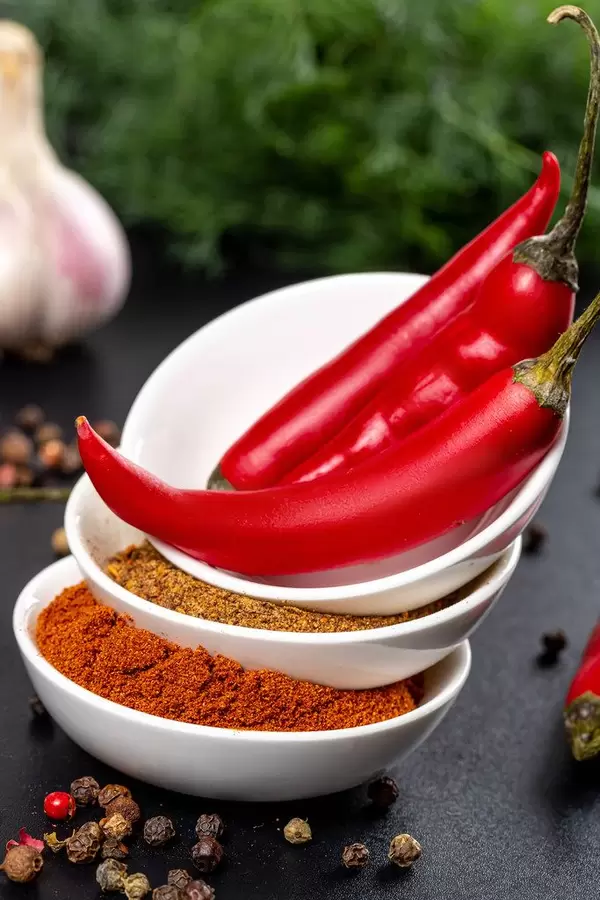 Food background with natural spices on black