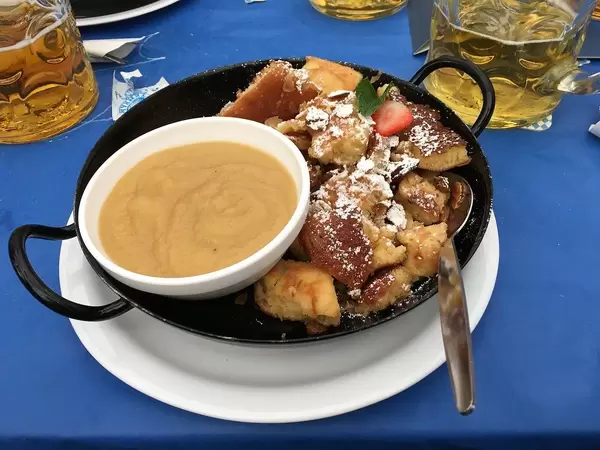 Food Photo of Pan with Sweet Dessert Kaiserschmarrn with Apple Sauce at Oktoberfest in Munich, Germany