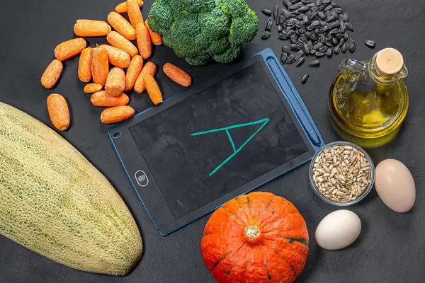 Foods with lots of vitamin A on a black background. View from above (Flip 2019)