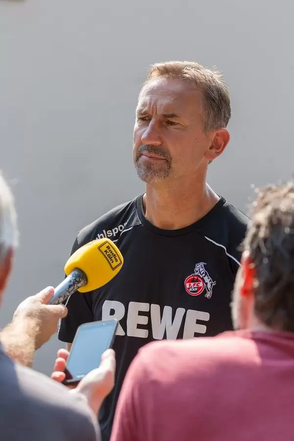 Football coach Achim Beierlorzer talks to the press after training his team