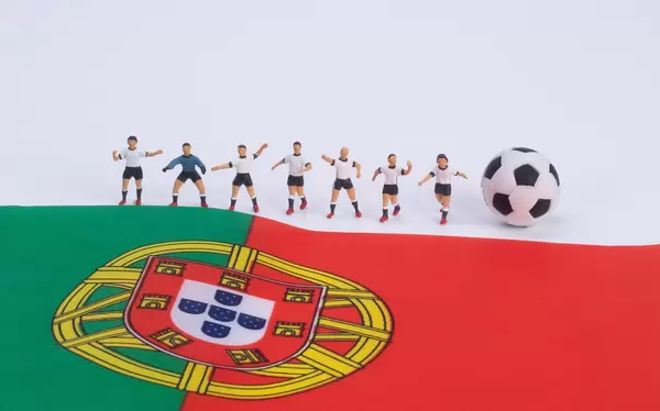Football players and flag of  Portugal