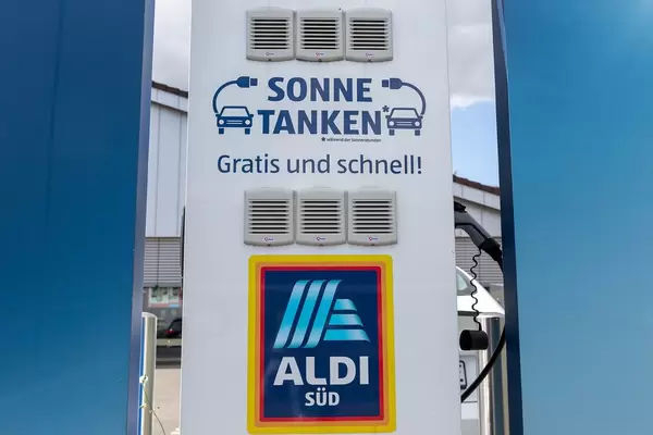 For more sustainability: free electric charging station, usable during sun hours, for e-bikes on an Aldi-Süd parking lot
