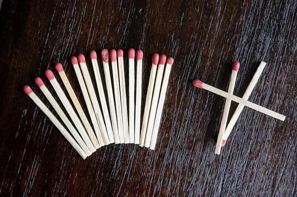 Formation of matches over wooden table