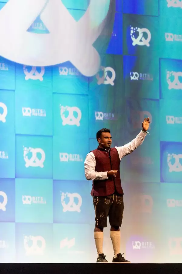 Founders conference Bits & Pretzels hosted by Dan Ram, who is waving to the audience