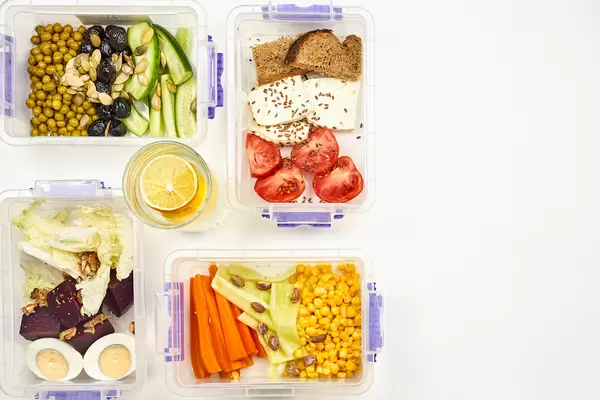 Four packs of dieting food with lemonade water for the whole day