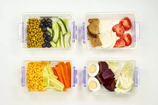 Four plastic box with healthy and organic meal