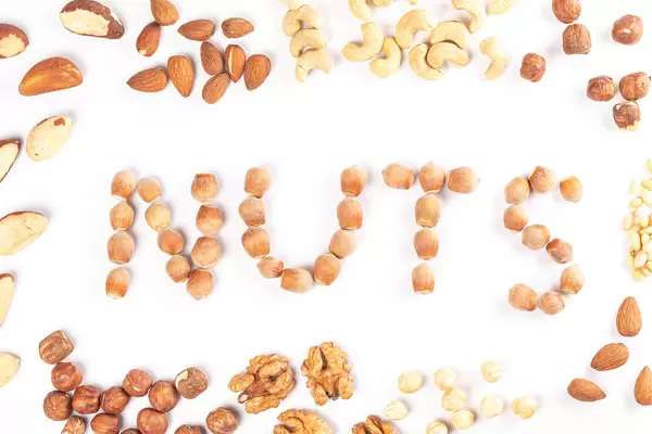 Frame of different varieties of nuts with an inscription in the middle