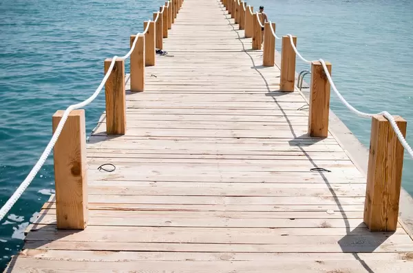 Freedom: Wooden bridge to the sea.