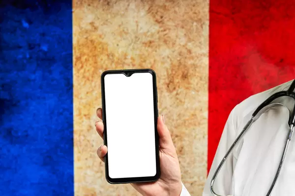 French doctor holding a smartphone with empty screen