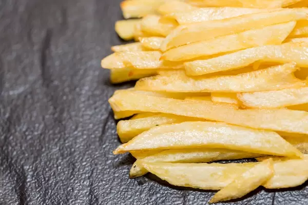 French fries on black background  Flip 2019