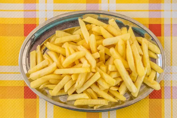French fries on metal plate