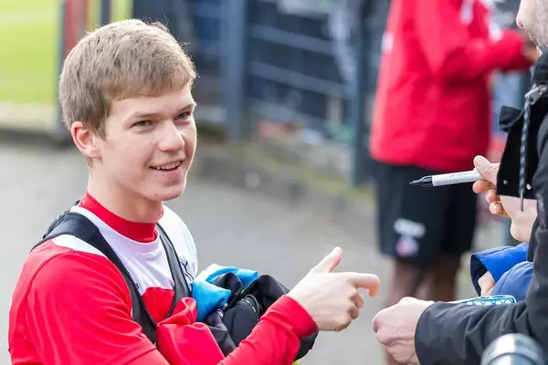 French soccer player Vincent Koziello giving autographs