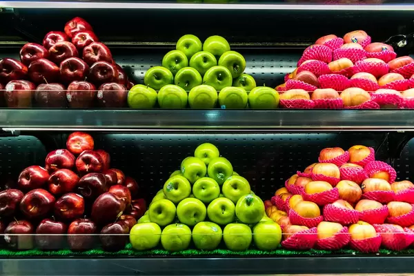 Fresh apples displayed in a fruit stand
