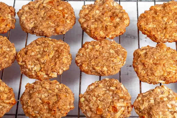 Fresh baked chip oatmeal cookies on metal rack (Flip 2019)