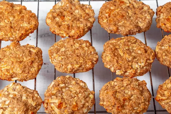 Fresh baked chip oatmeal cookies on metal rack