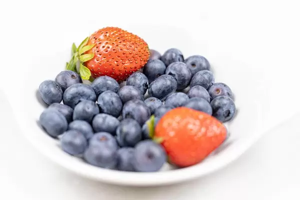Fresh Blueberries and Strawberries served in the bowl