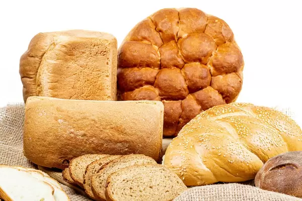 Fresh bread of different varieties on burlap