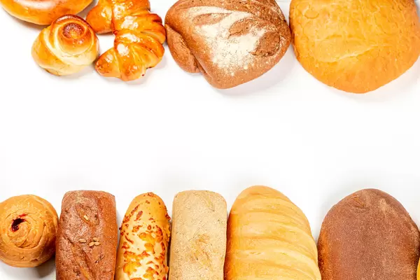Fresh bread on white, top view with space for your text