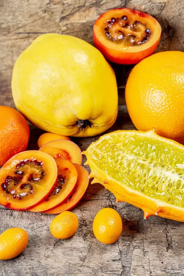 Fresh exotic fruit on an old wooden background (Flip 2020)