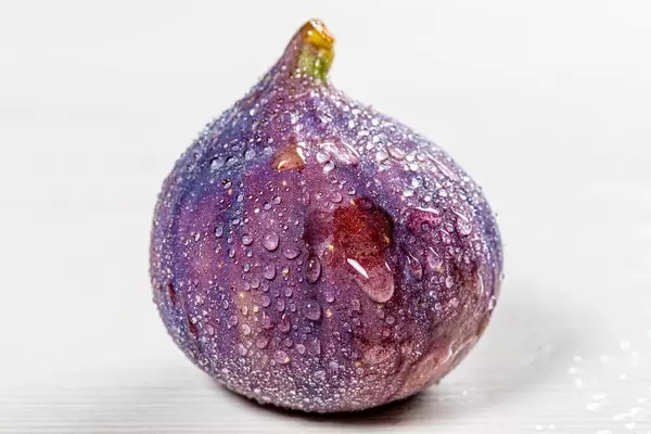 Fresh figs with water drops on white background (Flip 2019)