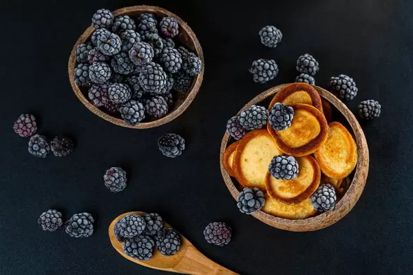 Fresh fried pancakes with blackberries