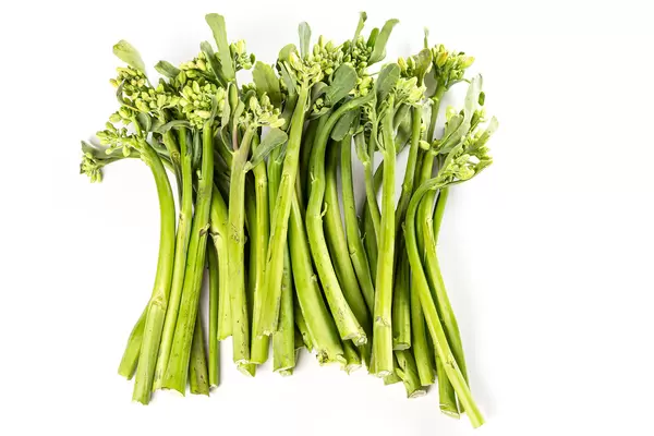 Fresh green broccolini on white background
