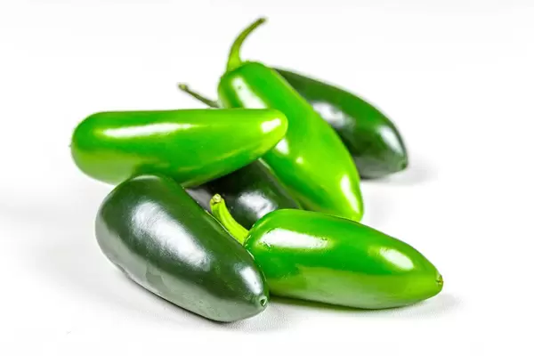 Fresh green chili jalapeno on white