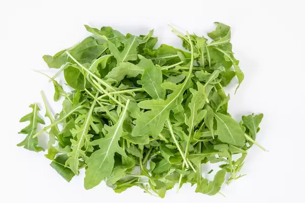 Fresh Healthy Green Rucola above white background (Flip 2019)
