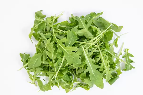 Fresh Healthy Green Rucola above white background