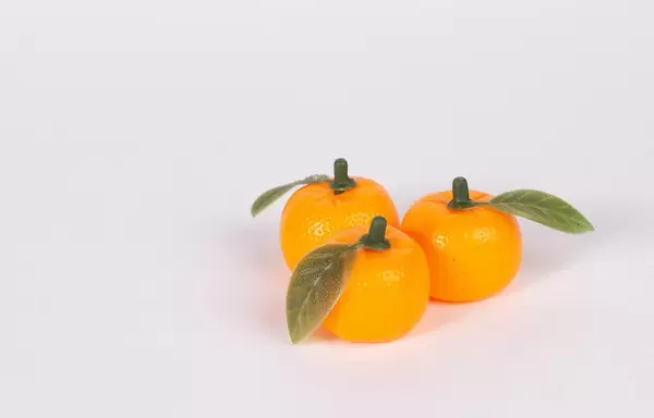 Fresh orange fruits on white background