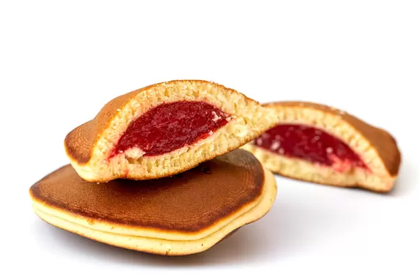 Fresh pancakes with berry jam inside