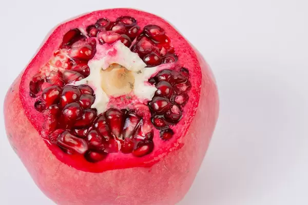 Fresh Pomegranate above white background (Flip 2019)