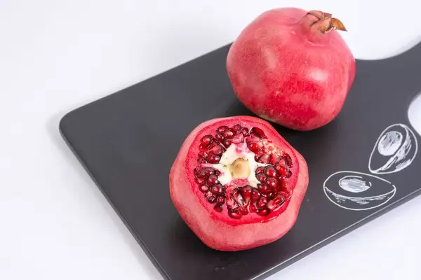 Fresh Pomegranate on the black tray