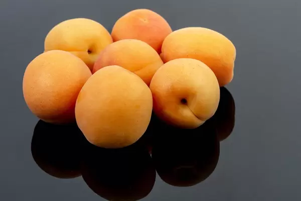 Fresh raw Apricots on the black background (Flip 2019)