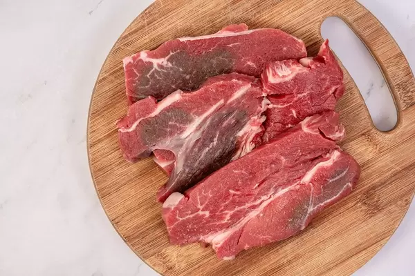 Fresh Raw Beef on the wooden board