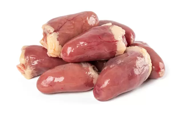Fresh raw chicken hearts on white background