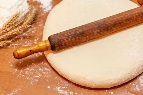 fresh raw dough for pizza or bread baking