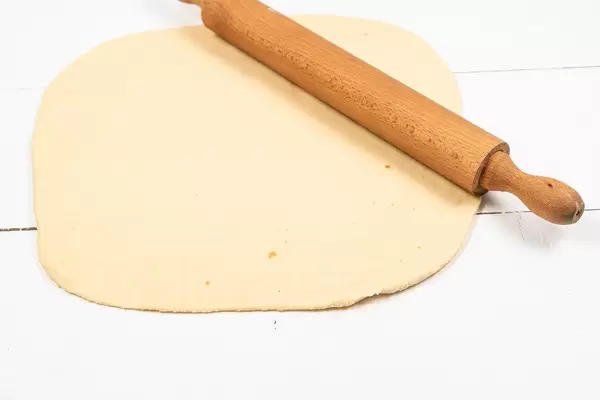 Fresh raw Dough with wooden Rolling Pin (Flip 2020)