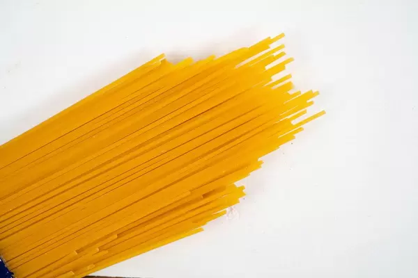 Fresh Raw Spagheti above white background (Flip 2020)