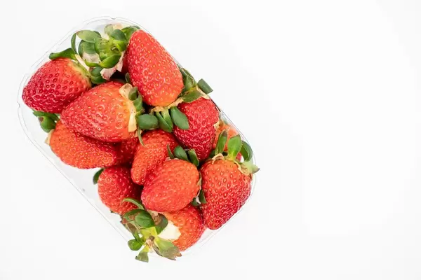 Fresh Raw Strawberries above white background with copy space (Flip 2020)