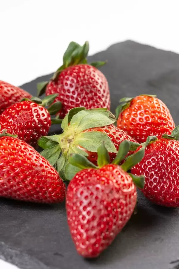 Fresh Red Strawberries on the black tray
