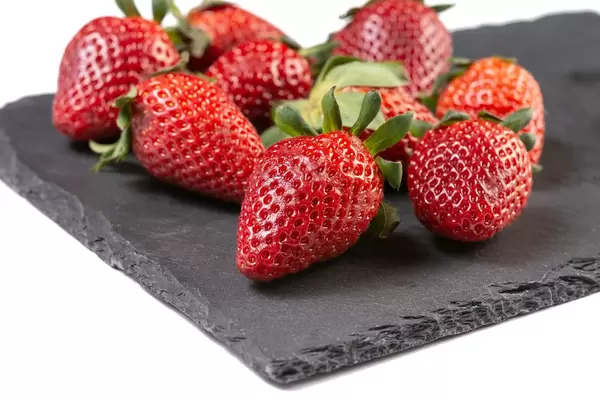 Fresh Red Strawberries on the stone tray