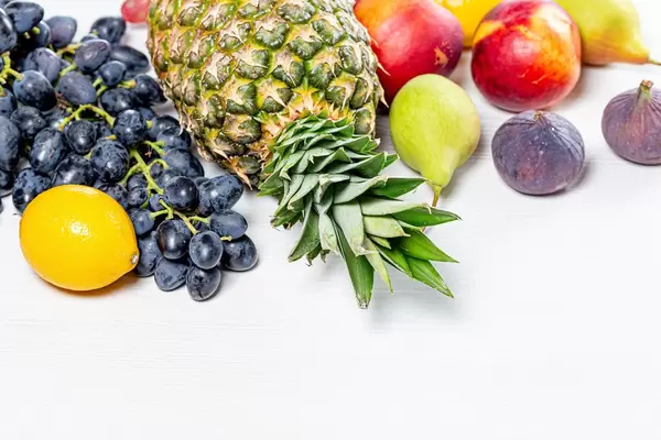 Fresh ripe fruit on white background. The concept of vitamins, healthy foods (Flip 2019)