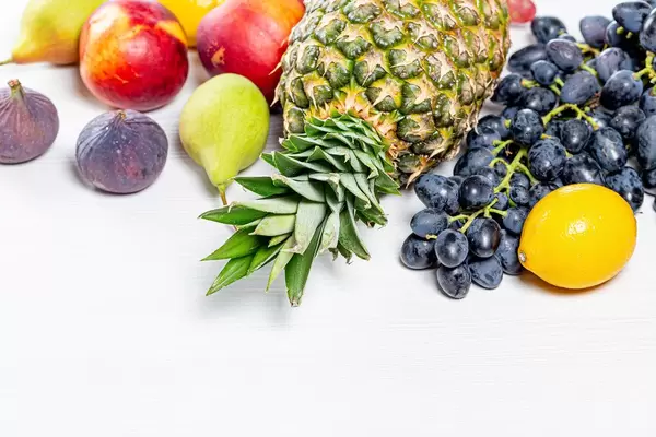 Fresh ripe fruit on white background. The concept of vitamins, healthy foods