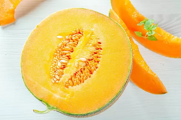 Fresh ripe melon with mint leaves